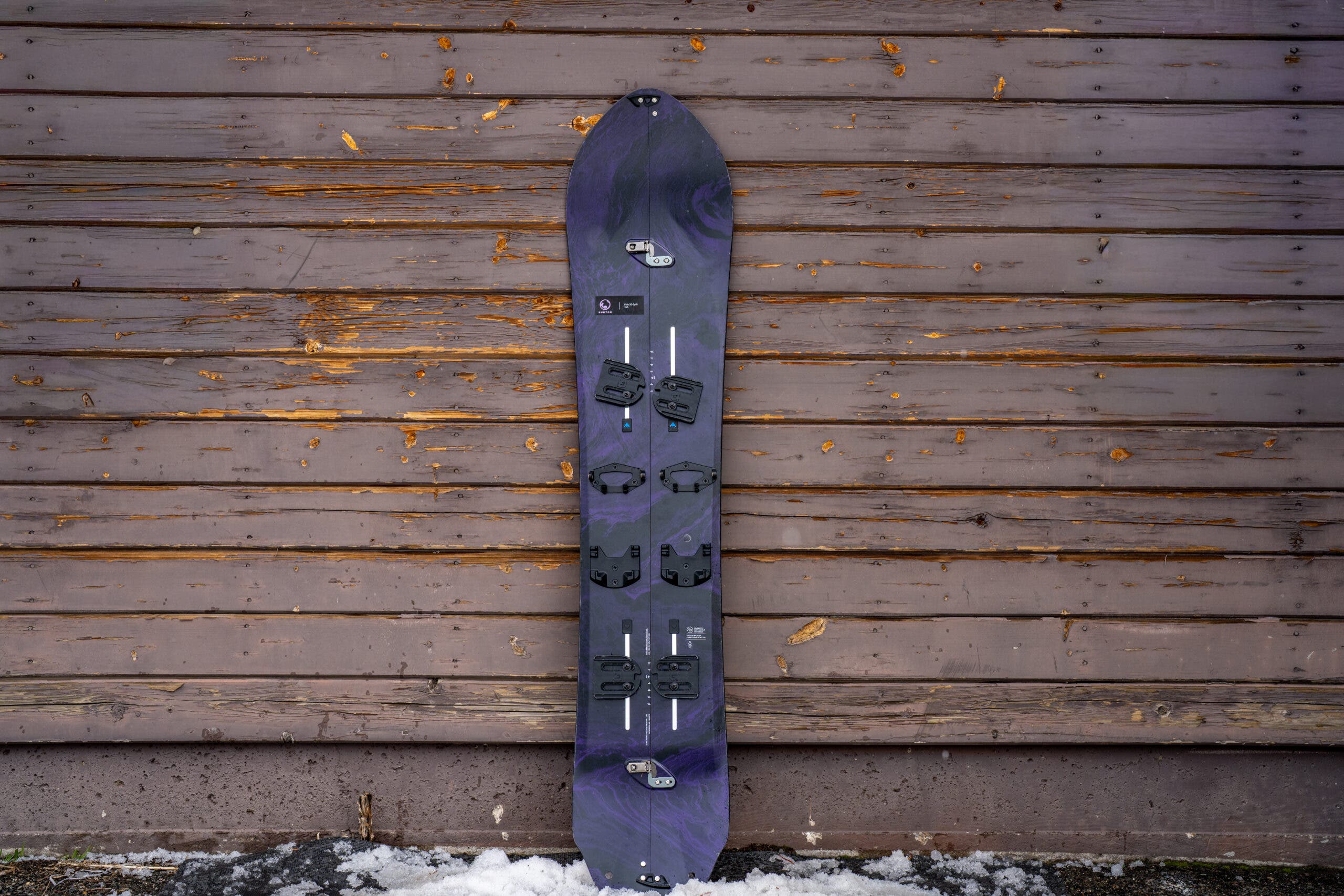 Burton Fish 3D Splitboard leaning against weathered building
