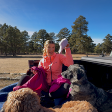 JamiLee Hoglind in truck with dogs