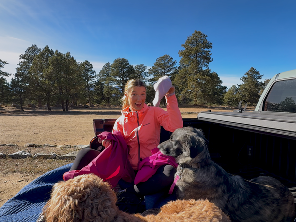 JamiLee Hoglind in truck with dogs