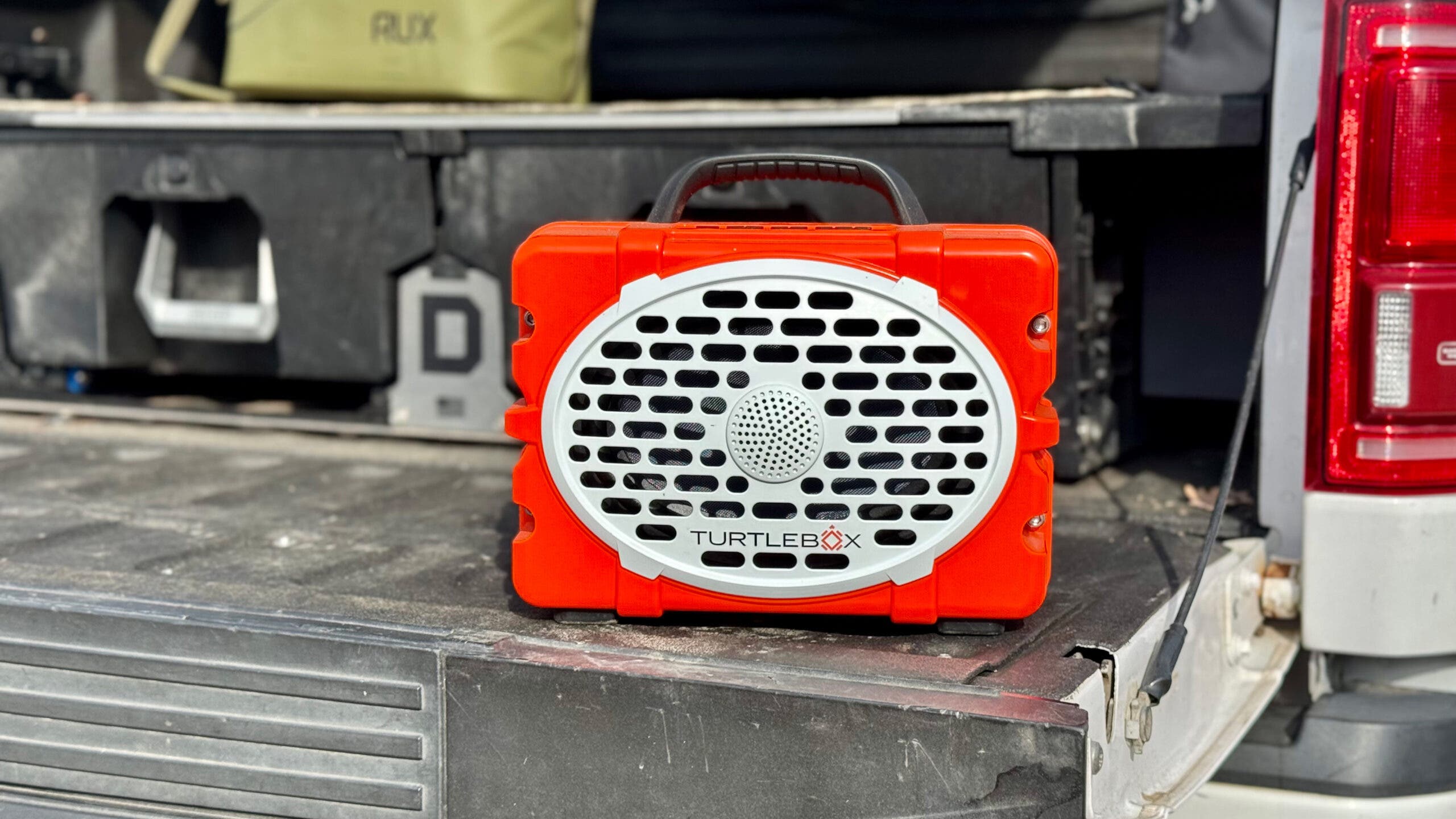 Red Turtlebox Speaker on truck bed for tailgating