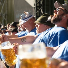 men holding beer in agony