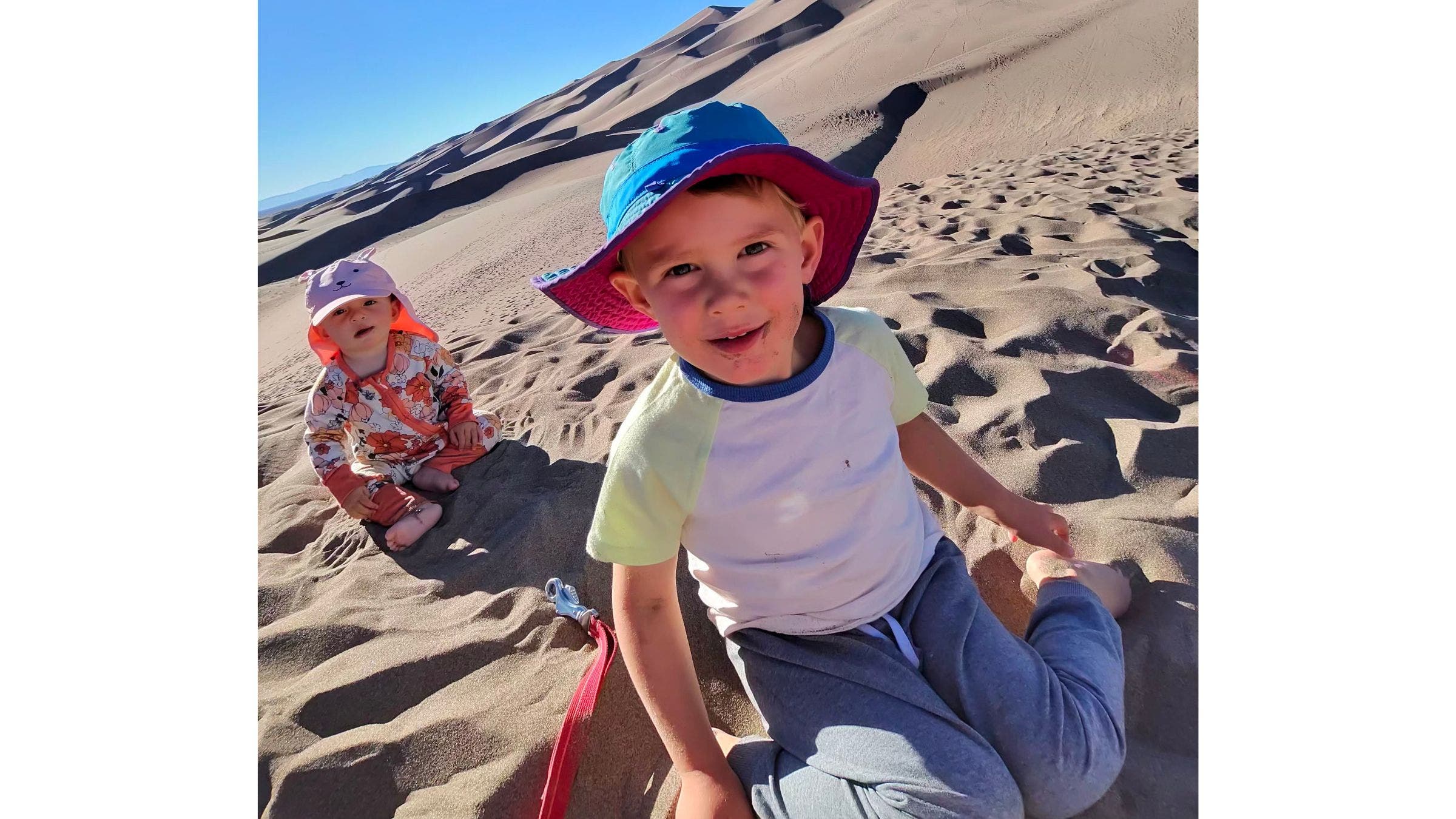 two little kids in sand