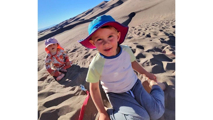 two little kids in sand