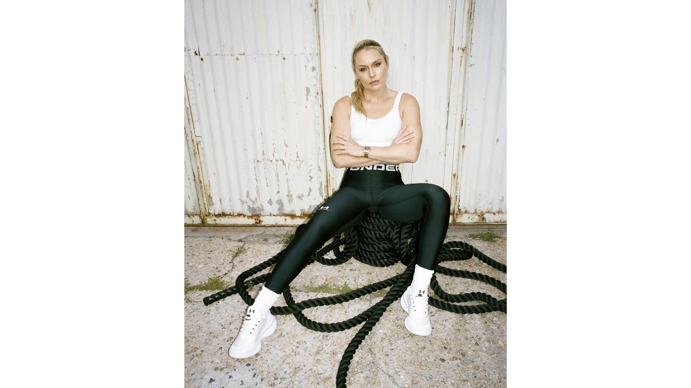 Lindsey Vonn sits on top of battle ropes