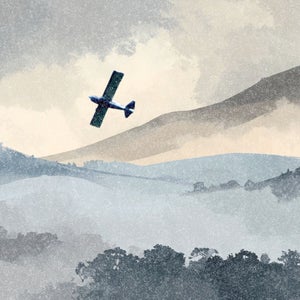 plane flying over mountains