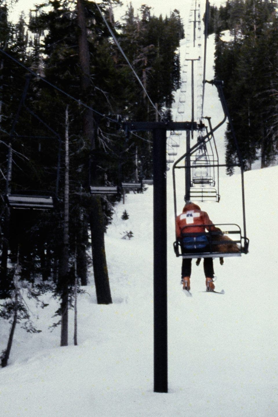 A skier riding the lift at Kirkwood Mountain Resort