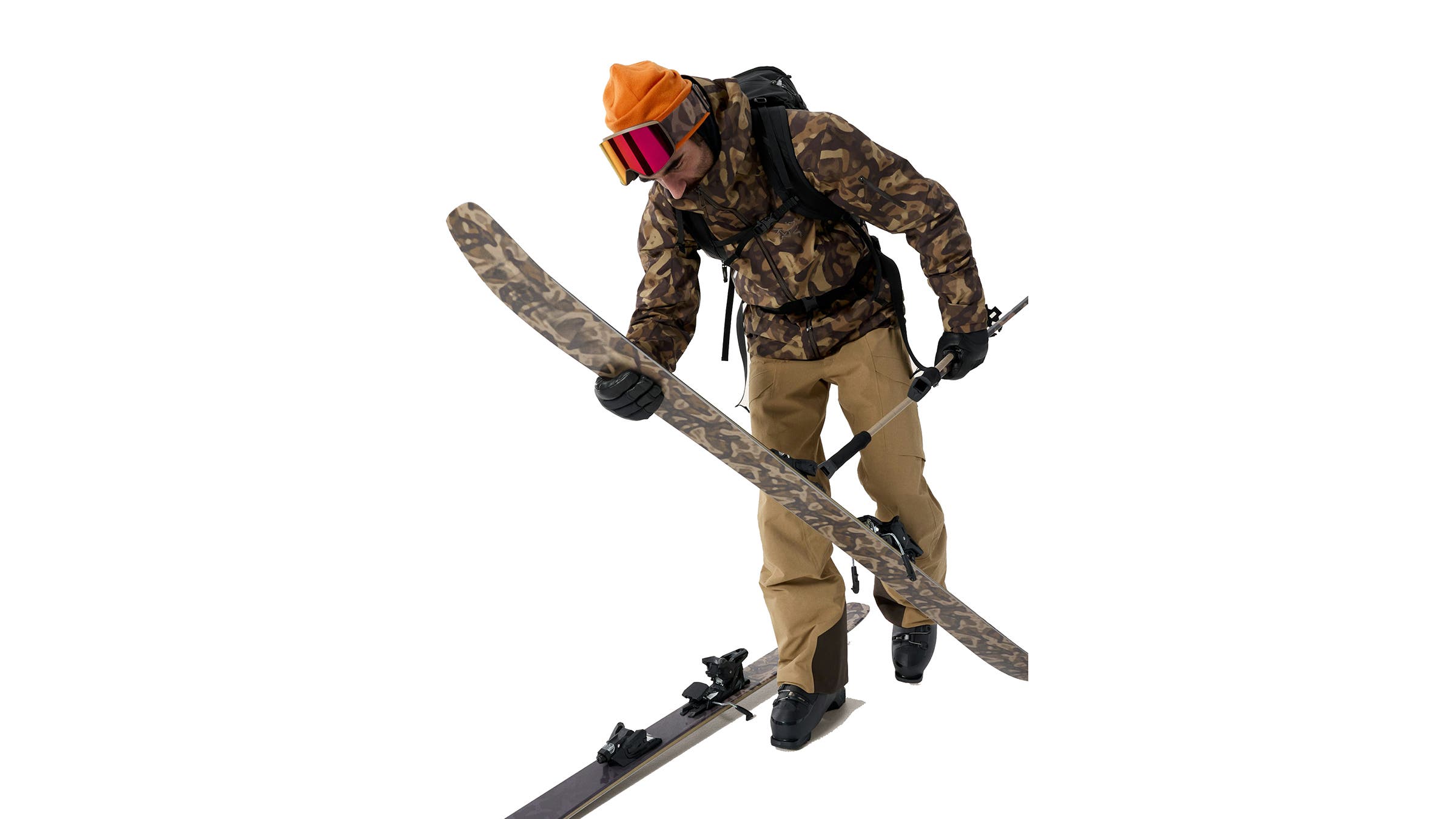 Arc'Teryx and Atomic collab, matching ski kit in camo print on male skier