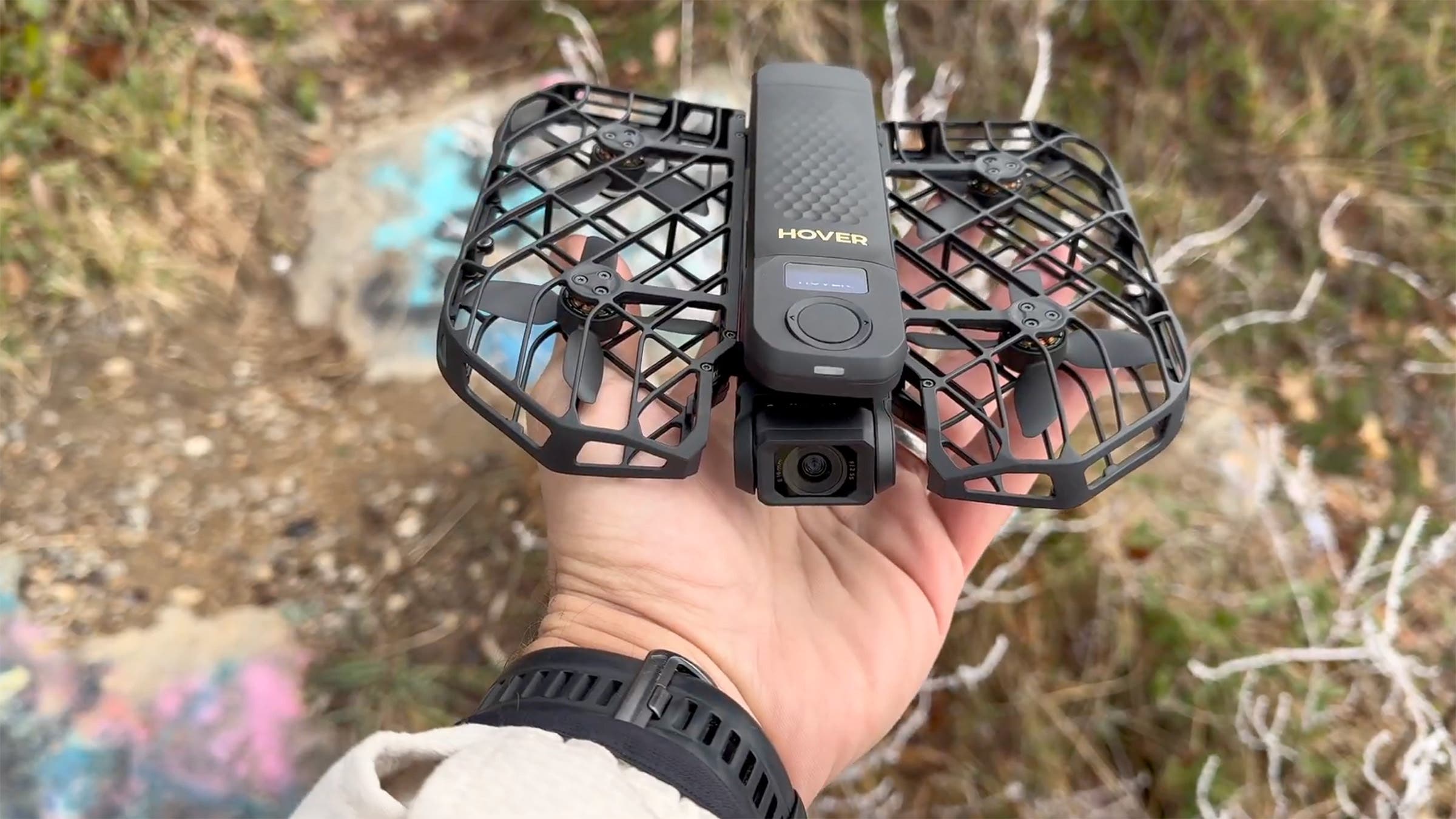 Closeup of HoverAir X1 ProMax drone on palm of man's hand