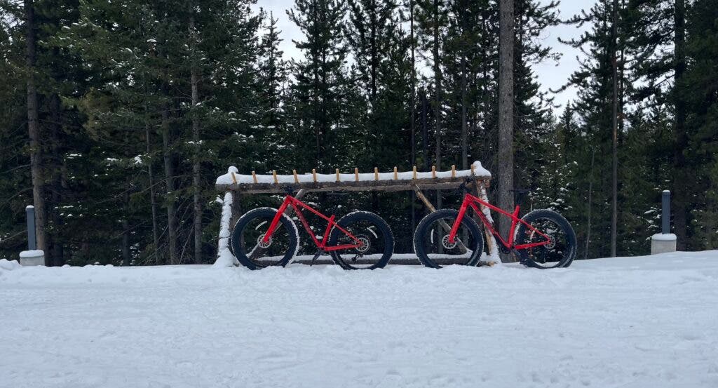 two red fat tire bikes in the snow at One&Only Moonlight Basin
