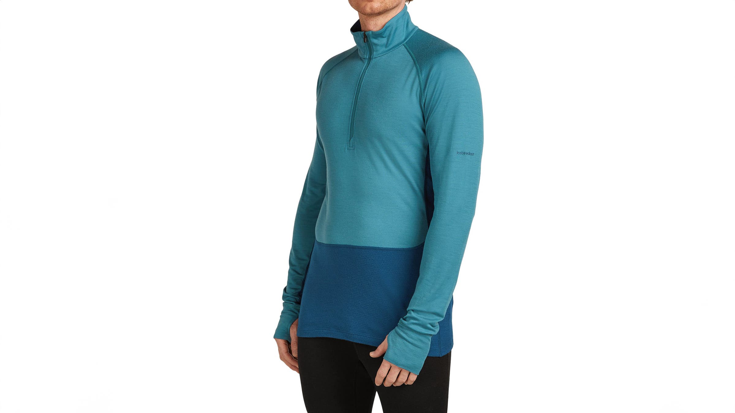 A model wearing an Icebreaker Merino 200 ZoneKnit teal thermal in front of a white background