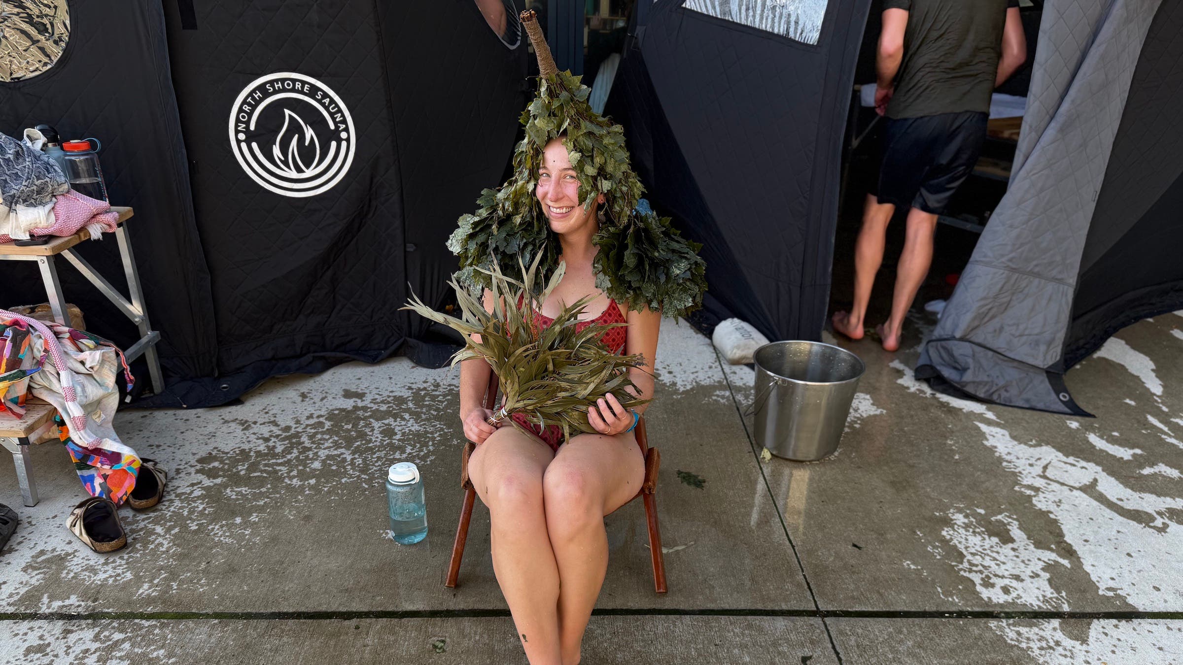 The author sitting with branches on her head