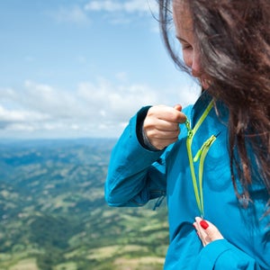 Hiker putting on a jacket