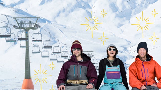 three skiers in front of a lift