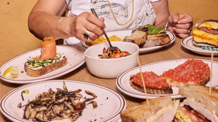 Close up of various plates of food.