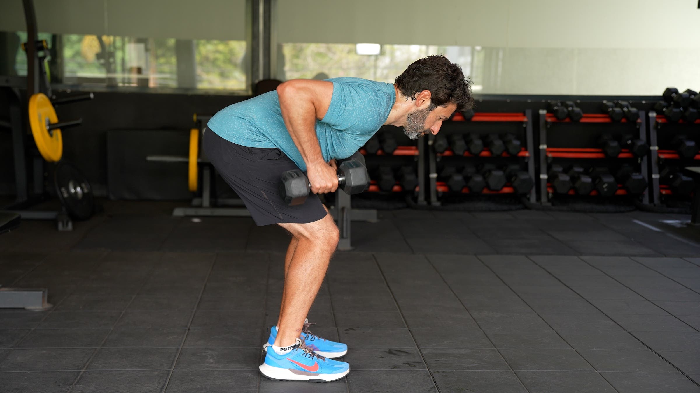 A man demonstrates a bent-over row