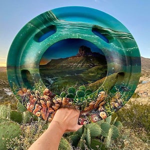 “El (Hub)Capitan” is an acrylic painting on a truck hubcap found on the side of the highway that parallels the Guadalupe Mountains National Park