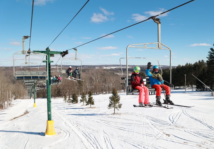 Skiers on chairlift