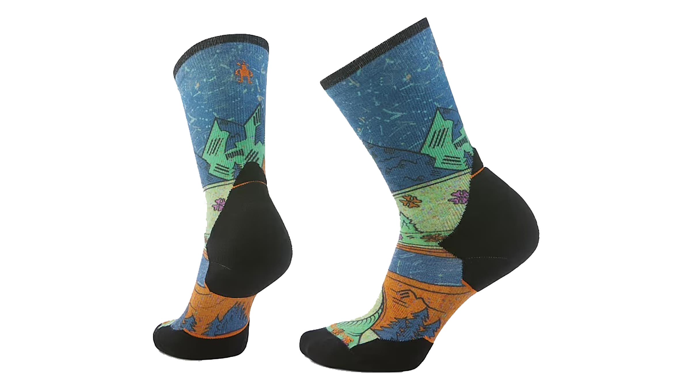 Smartwool Trail Run Print Crew Socks featuring a vibrant outdoor landscape design with blue skies, green mountains, and orange sunsets against black reinforced heels and toes.