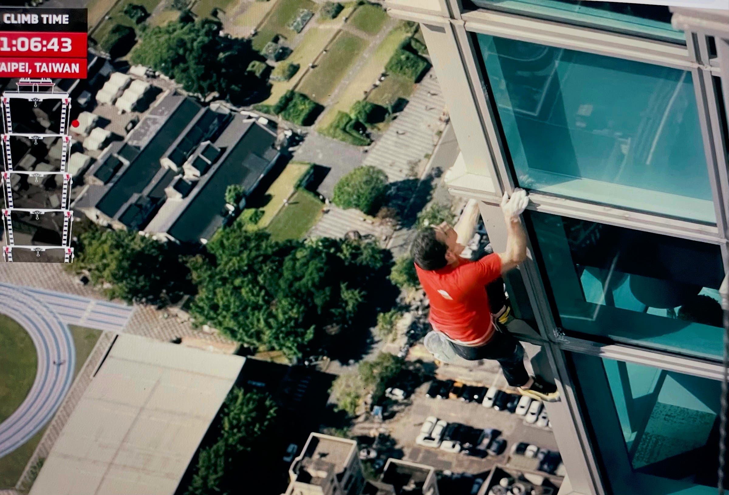 screenshot of Honnold climbing Taipei 101