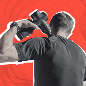 person using a massage gun