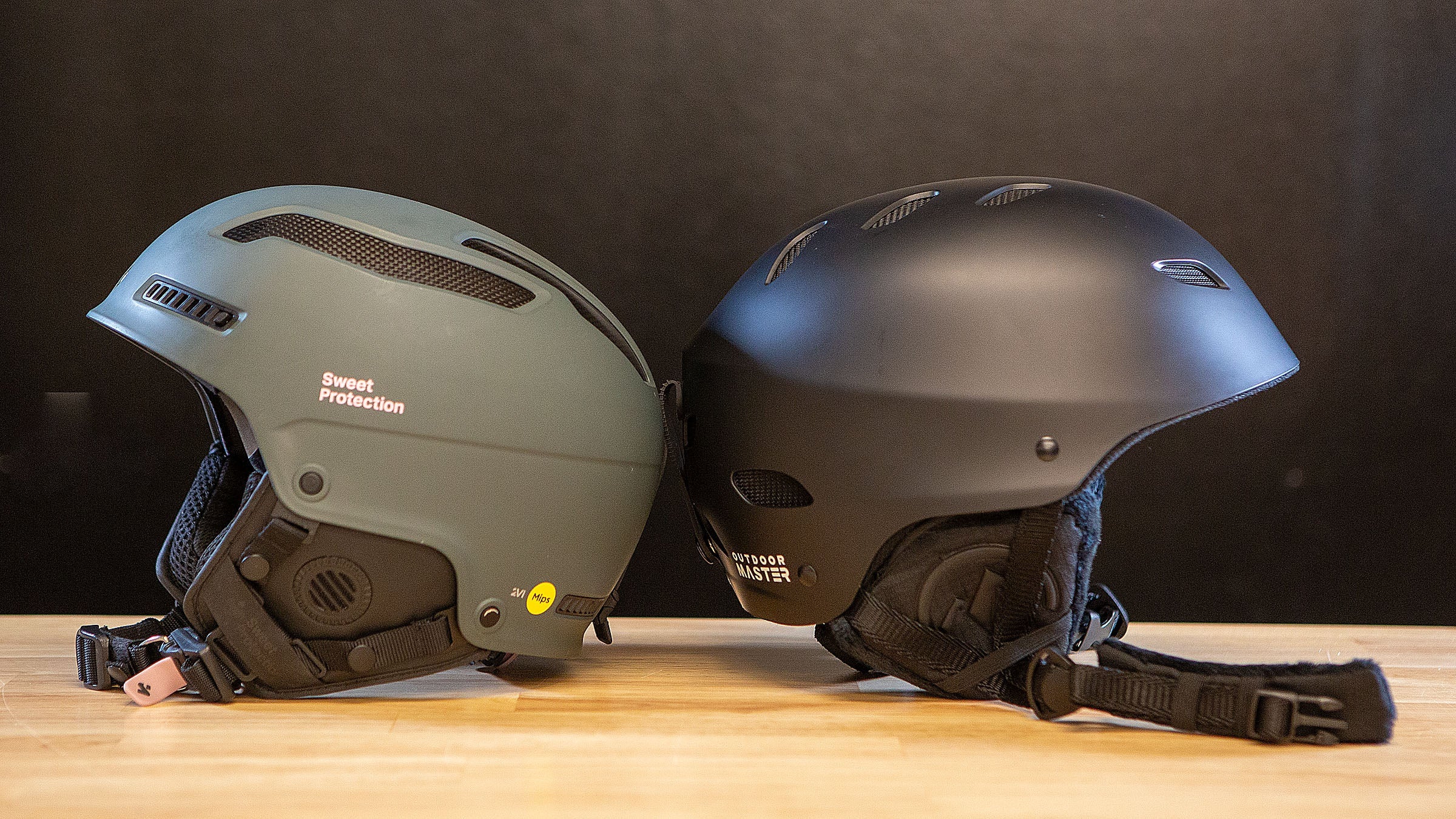 Side by side photo comparison of Outdoor Master Kelvin vs. Sweet Protection Trooper 2VI ski helmets.