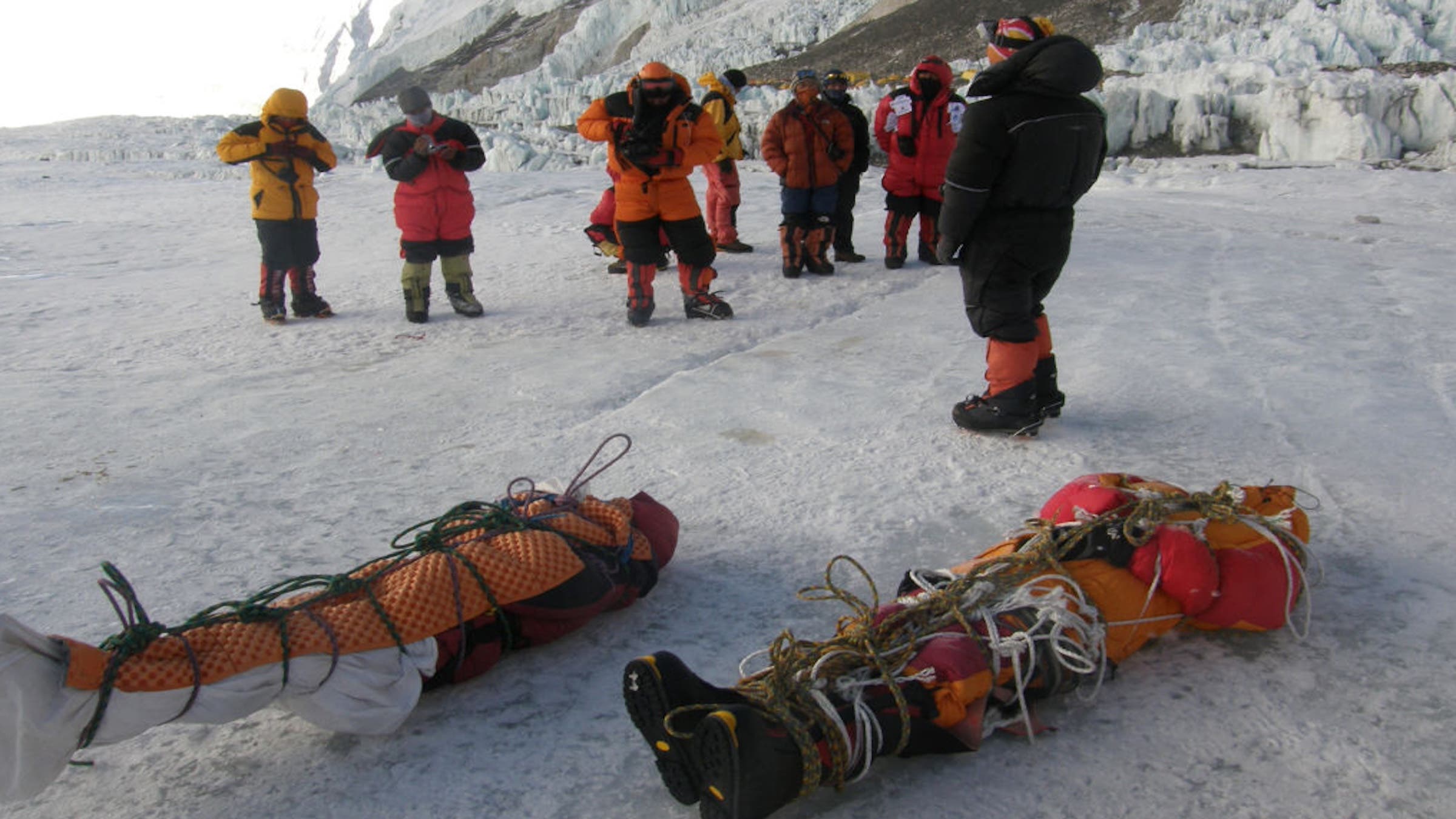 A photo taken in 2010 shows Nepali sherpas retrieving two corpses left on Mount Everest 