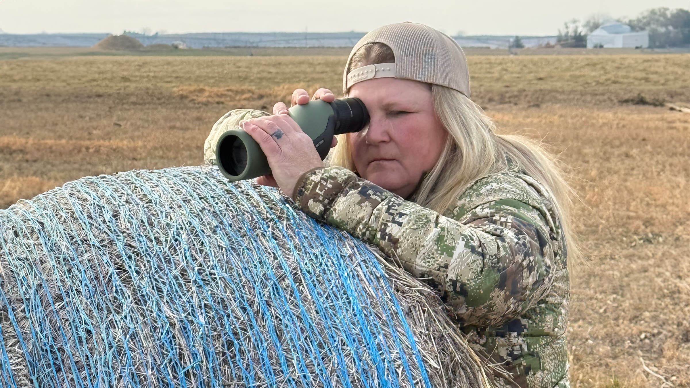 Hawke Spotting Scope woman searching in prairie.