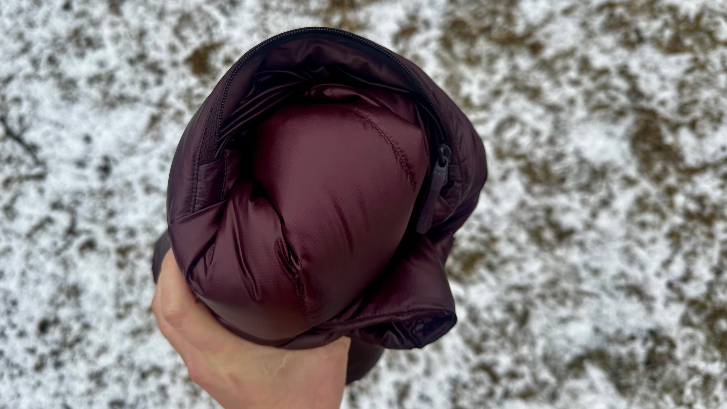 Rolled up Arc'teryx Cerium SV Down Puffer jacket.