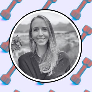 personal trainer jenny mccoy on a background of dumbbells