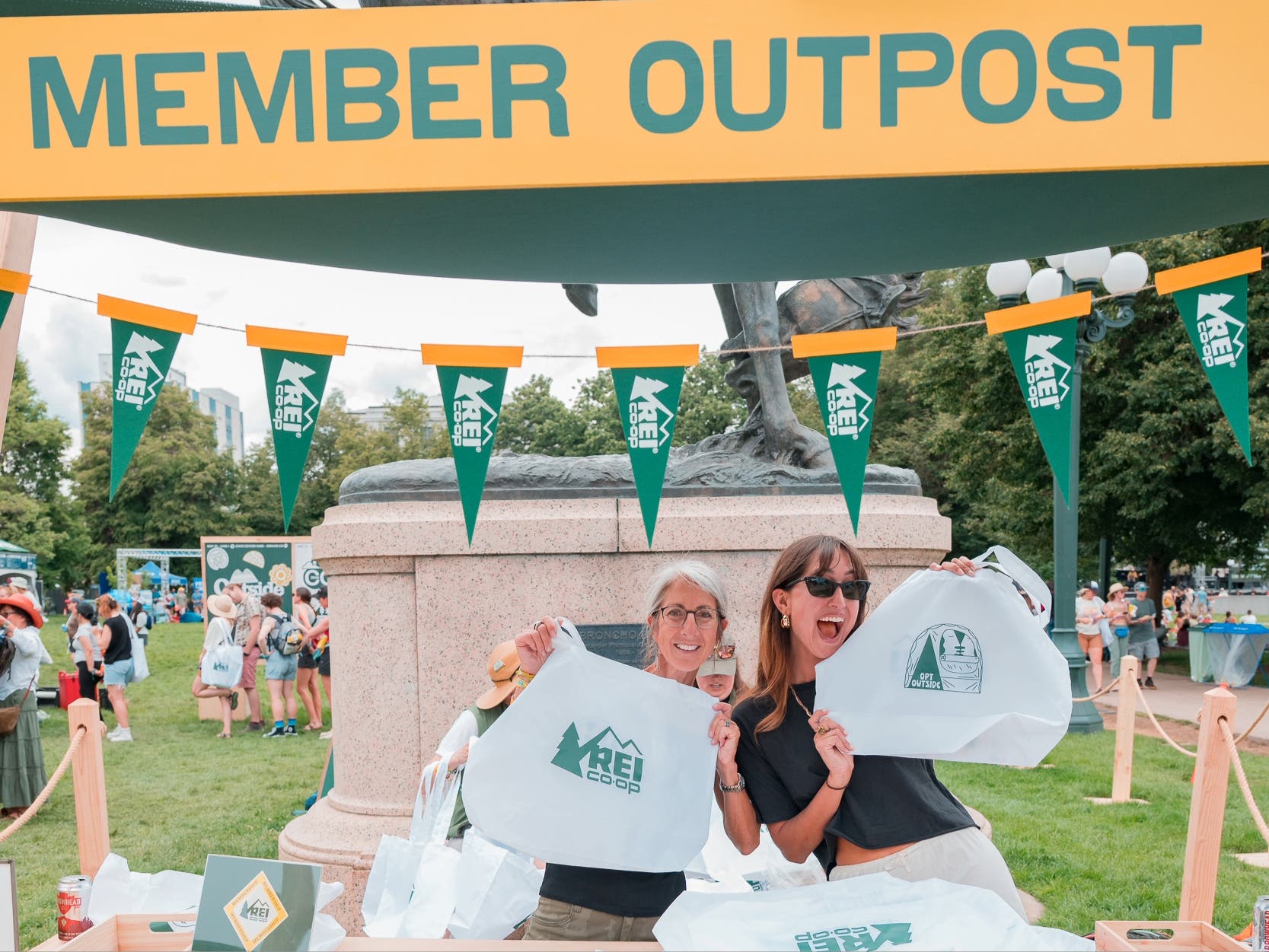 Women holding up tote bags