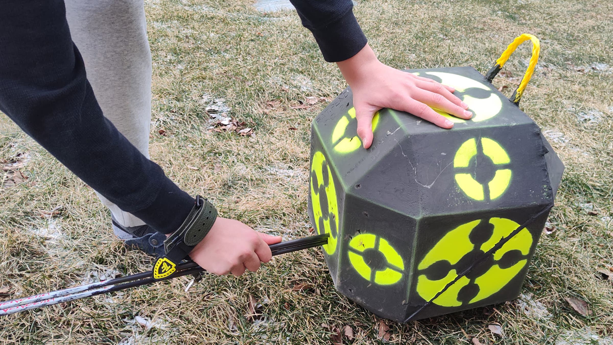 Rhinehart Target with arrow being pulled out of the block, perfect for hunting practice shooting.