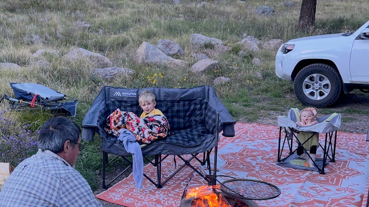 The author's family car camping, with the Nokian Tyres Outpost nATs in the background