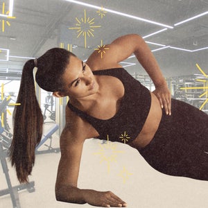 woman side planking at gym