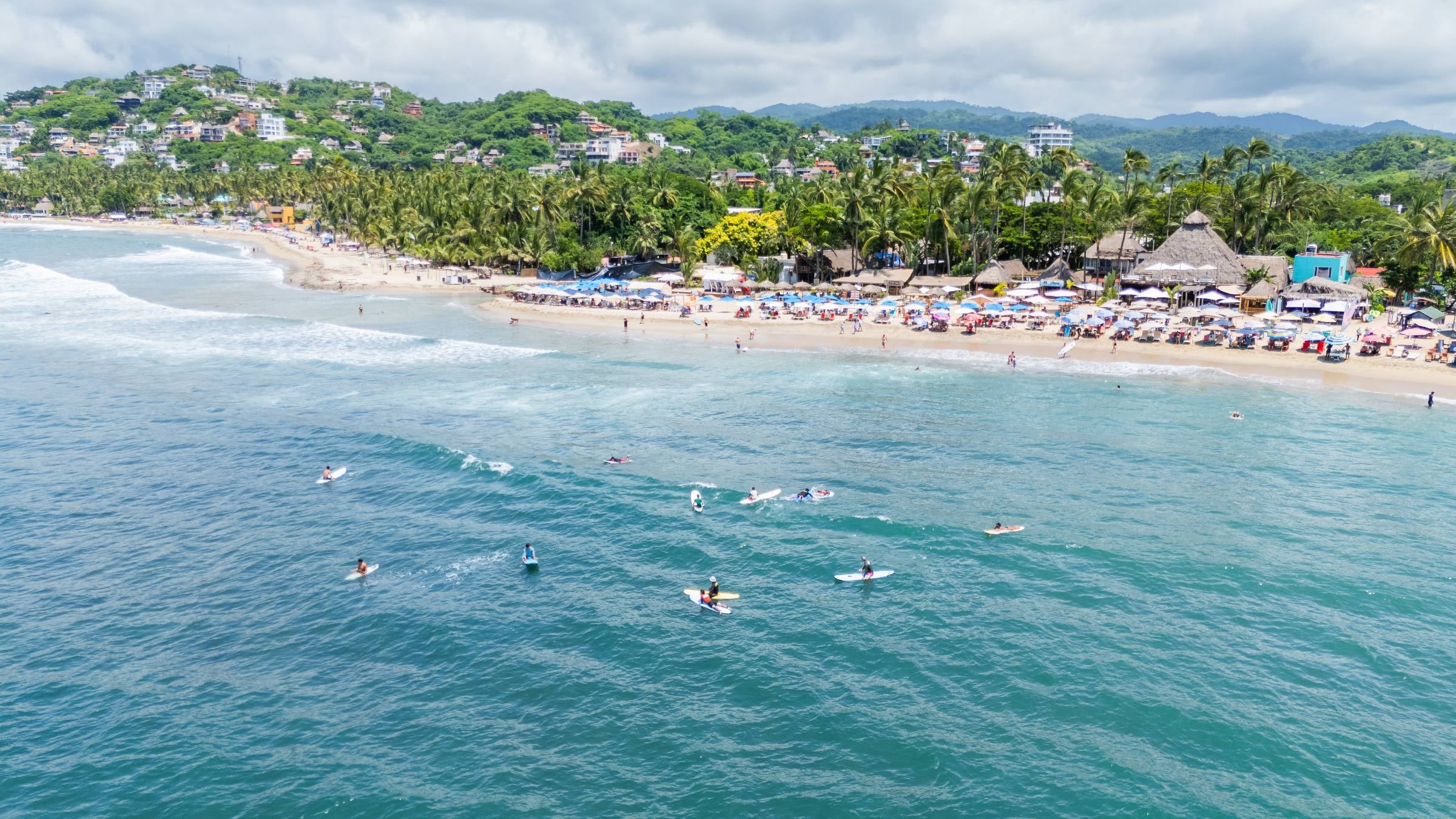 Surfers at Sayulita Beach, in Nayarit, Mexico.