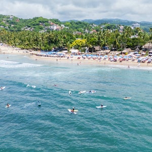 Surfers at Sayulita Beach, in Nayarit, Mexico.
