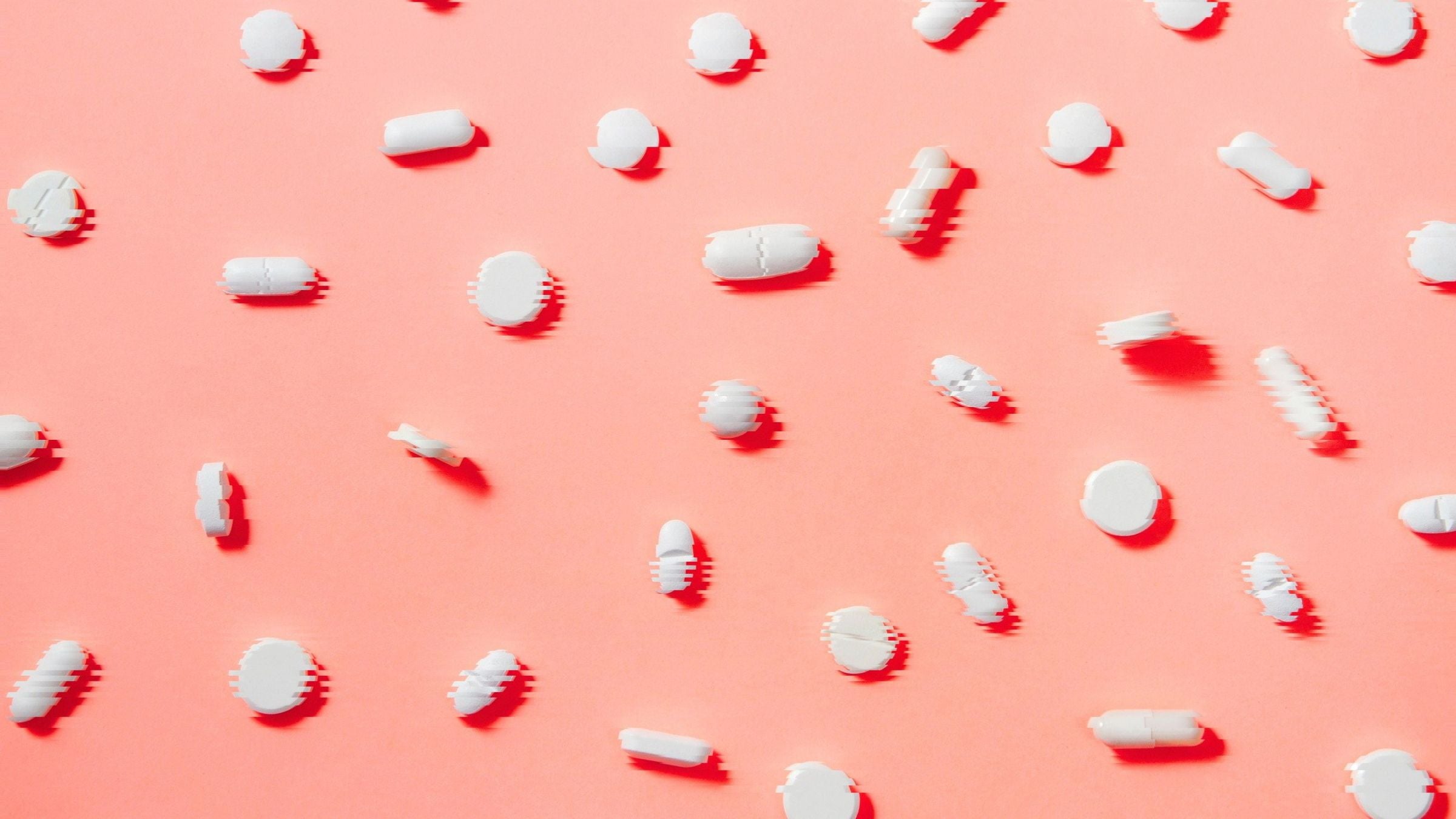 pills on a pink background