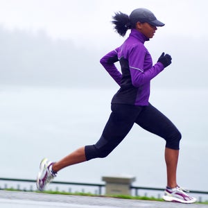 woman running in purple shirt