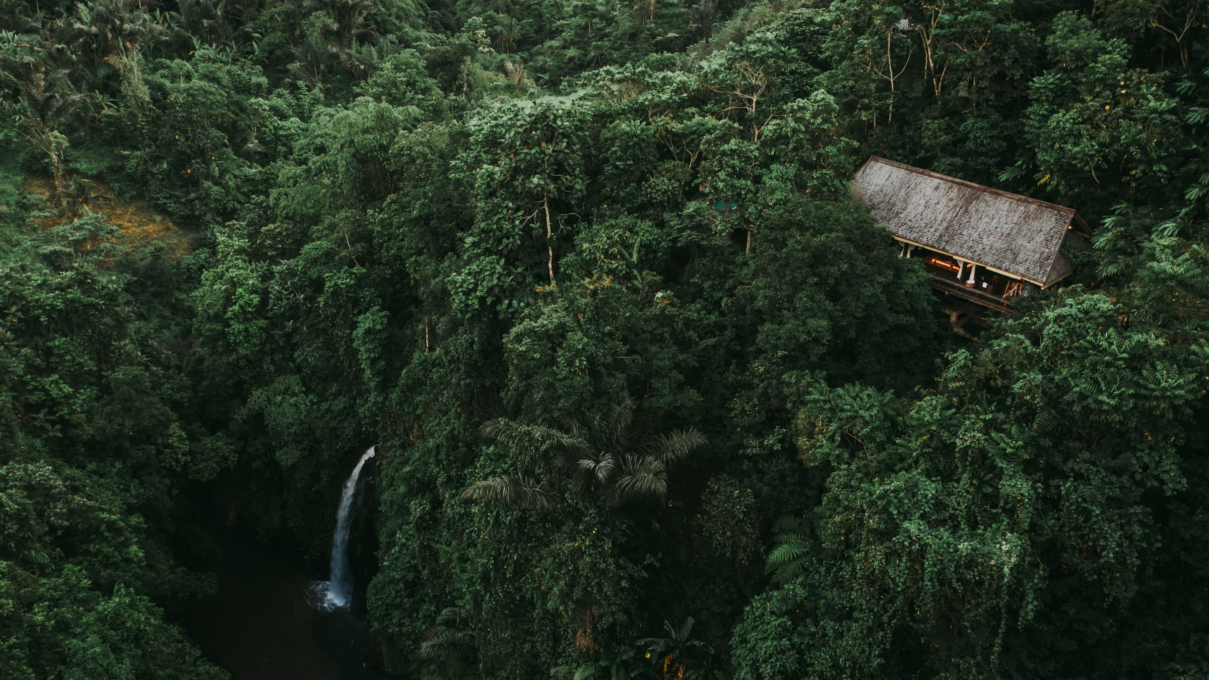 Buahan unit sitting above a waterfall.