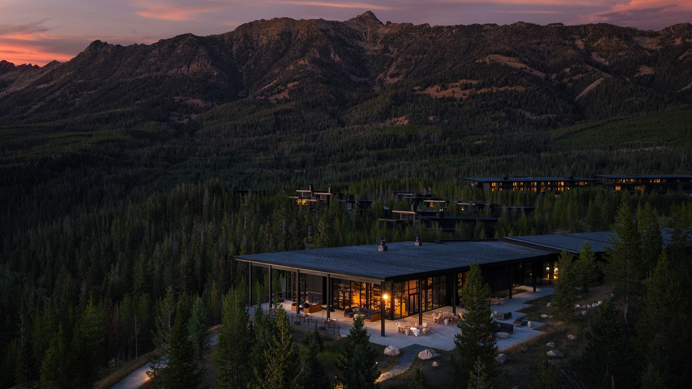 One & Only Moonlight Basin nestled at the foot of a mountain range.