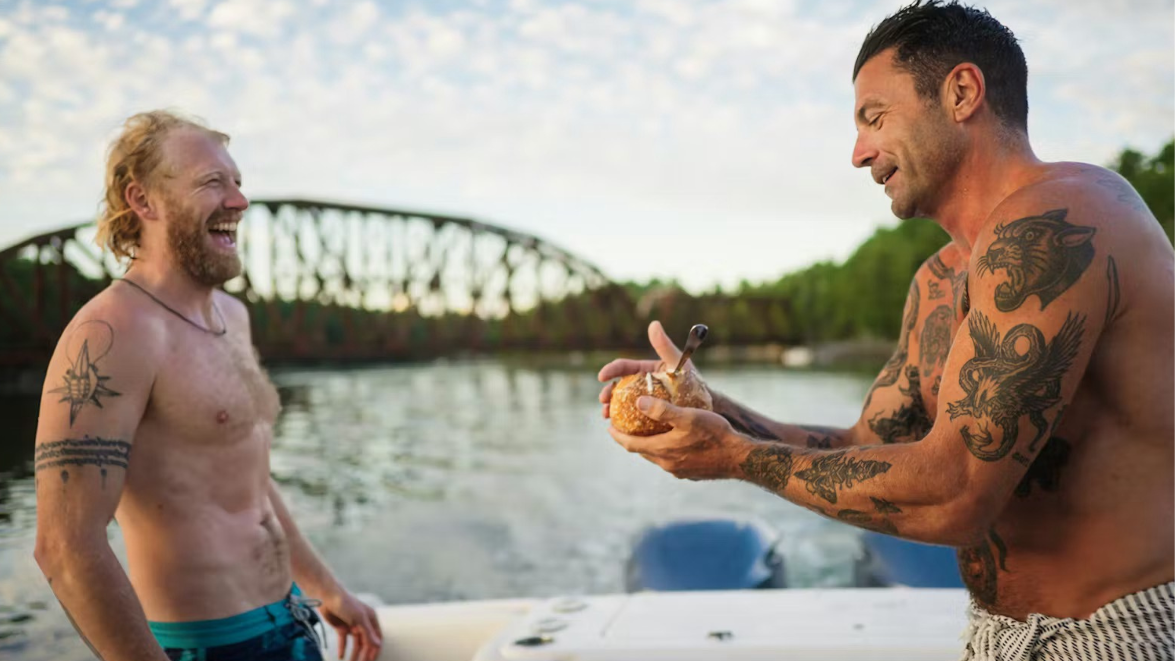 josh rosen shirtless on a boat in Maine, eating chowder out of a bread bowl