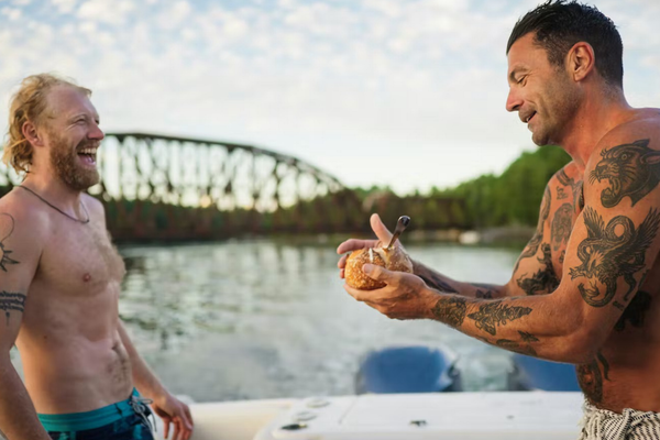 josh rosen shirtless on a boat in Maine, eating chowder out of a bread bowl