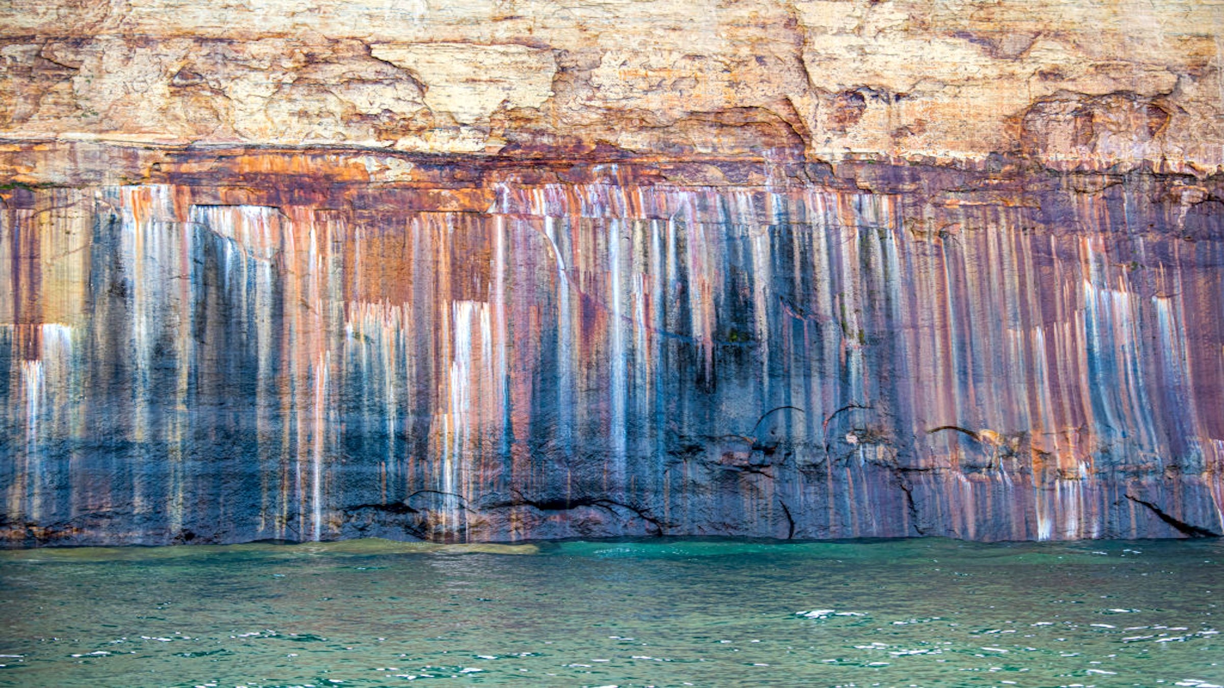 The group were charged a $100 fine and banned from Pictured Rocks for one year