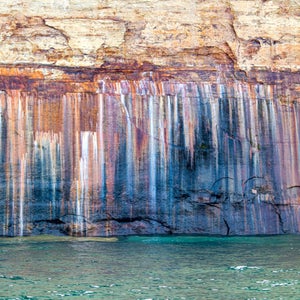 The group were charged a $100 fine and banned from Pictured Rocks for one year