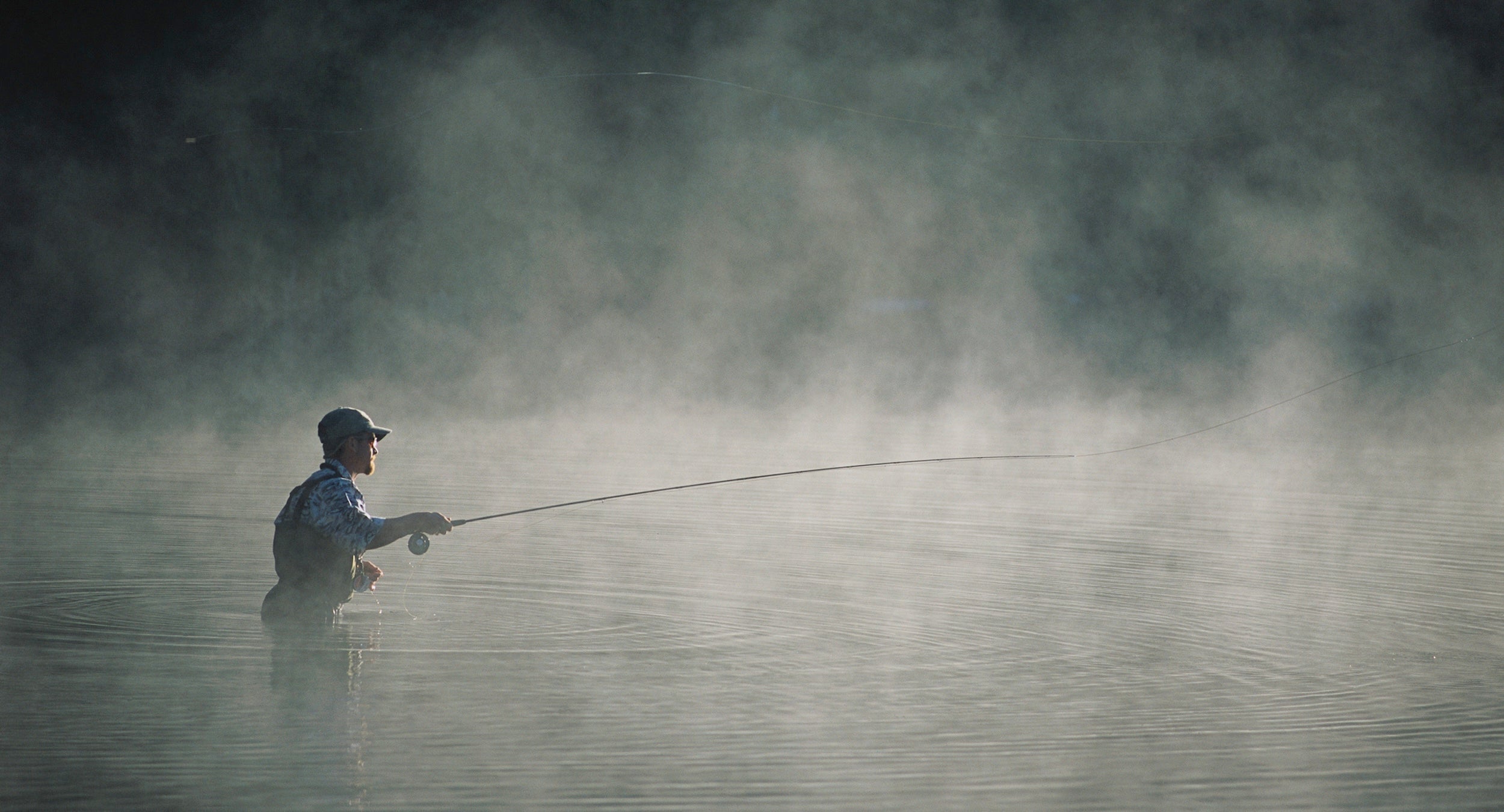 Fisherman casting in Morning Mist