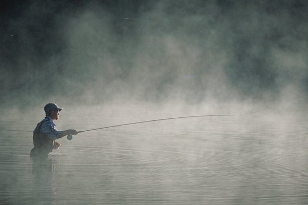 Fisherman casting in Morning Mist