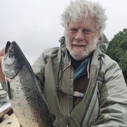 photo shows mike kurlansky holding a fish