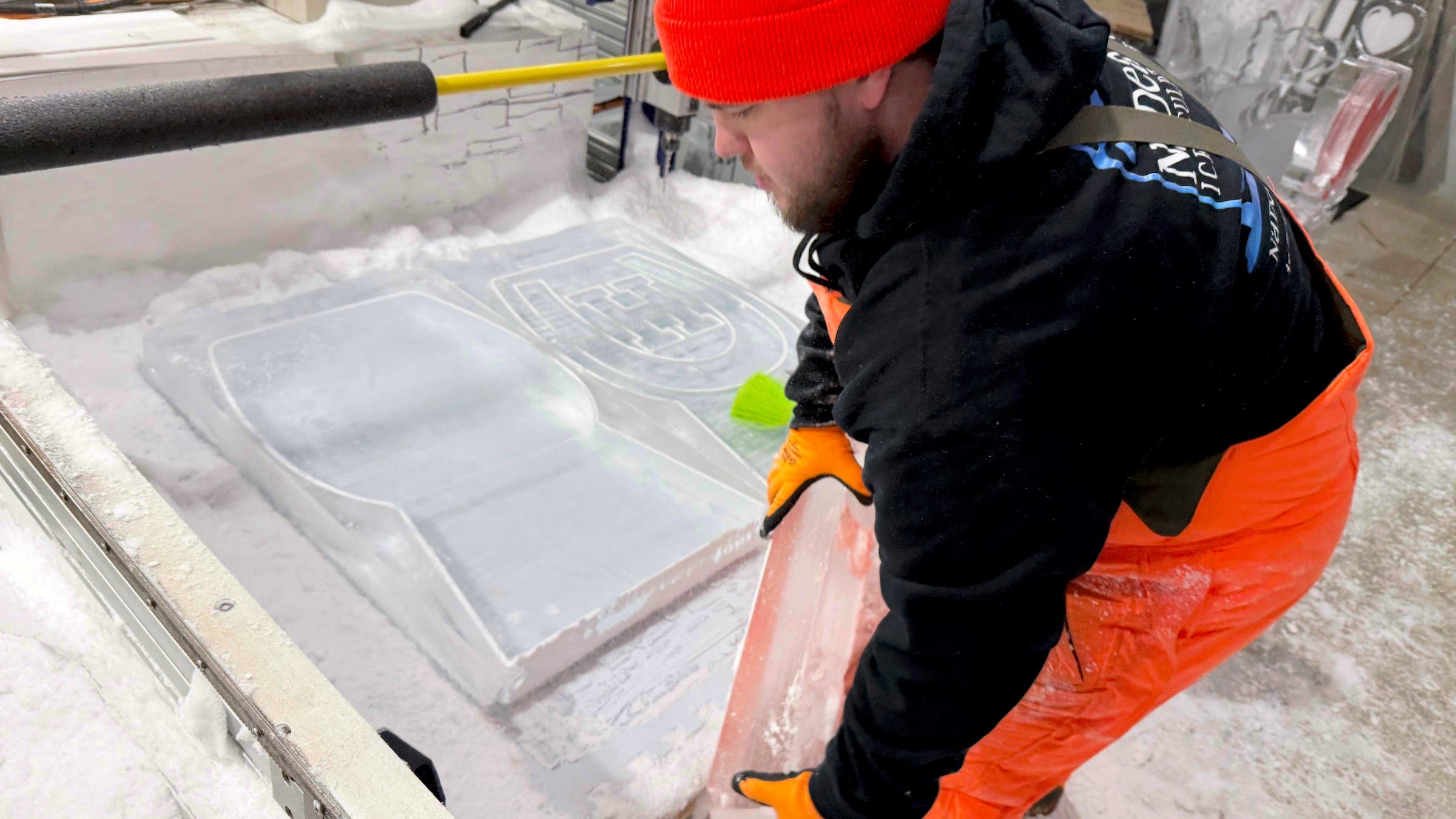 An employee works on a CNC machine