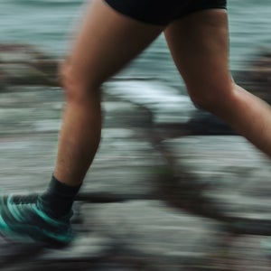 person running on rocks