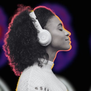 person with headphones with a brain scan background