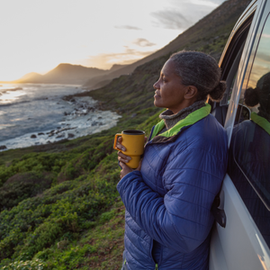 woman enjoying the coast in celebration of Earth Day 2026